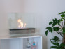 Liten biopeis med stål i bunnen og glassplater på alle fire sider.