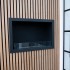 Foco One 800 - en-sidig bioetanol peis til installasjon i en vegg, med flammesyn fra fronten.